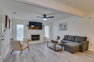 a living room with a couch and a fireplace at Beautiful 3BR Townhouse Close to Downtown Augusta in Augusta