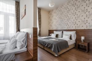 Posteľ alebo postele v izbe v ubytovaní Elit Boutique Rooms- Best Location by BQA + 37 fotografií
