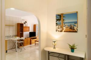 a kitchen and living room with a view of the ocean at Casa Ferro in Las Palmas de Gran Canaria