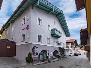 a large building with a clock on the side of it at Appartement Ambiente in Hopfgarten im Brixental