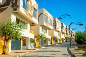 an empty street with a row of buildings at Arka Art Hotel in Tirana
