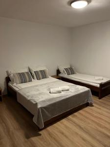 a bedroom with two beds with towels on them at Motel S7 in Goszczyn