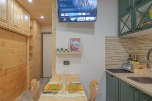 Kuchyň nebo kuchyňský kout v ubytování Casa SOLE- Loft moderno in montagna