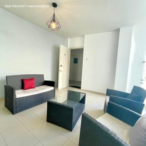a living room with two couches and a table at City Flats Apt.C307 in Larnaca