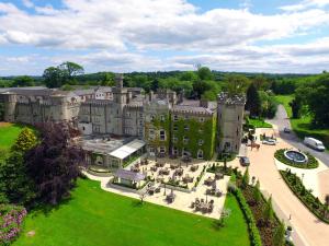 an aerial view of a large castle with a park at Cabra Castle Hotel in Kingscourt