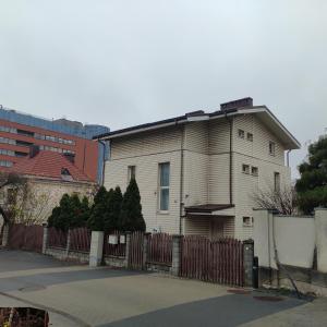 an older house with a fence in front of it at New Center of Vilnius in Vilnius