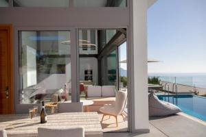 a house with a view of a swimming pool at Luxury Glass Villas in Syvota