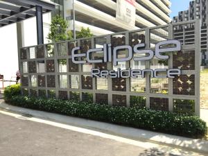 a sign for the entrance to a building at Cyberjaya Eclipse 5 Plus 2 PAX Blissful Suite in Cyberjaya