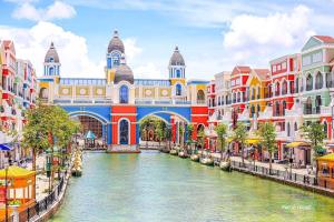 a view of a canal in a city with buildings at Thiên Ý Homestay in Phu Quoc