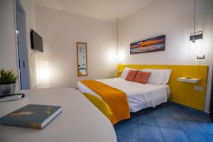 Posteľ alebo postele v izbe v ubytovaní Sonnino B&B