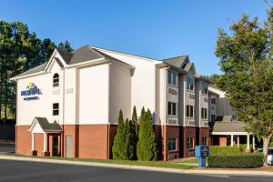 a rendering of the front of a hotel at Microtel Inn & Suites by Wyndham Woodstock/Atlanta North in Woodstock