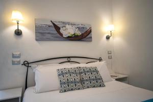 Posteľ alebo postele v izbe v ubytovaní Sonnino B&B