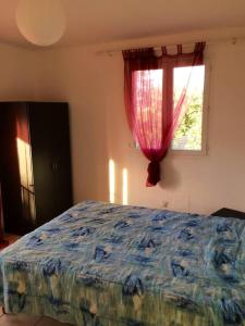 Posteľ alebo postele v izbe v ubytovaní Maison de 2 chambres avec terrasse et wifi a Ajaccio a 5 km de la plage