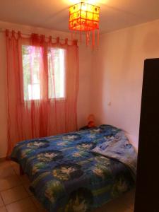 Postel nebo postele na pokoji v ubytování Maison de 2 chambres avec terrasse et wifi a Ajaccio a 5 km de la plage