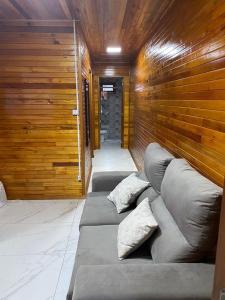 a room with three pillows on a couch in a room at Águia Dourada Hospedagem Casa 01 in Bom Jardim da Serra