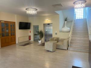 TV a/nebo společenská místnost v ubytování Hotel Michael