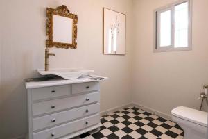 a bathroom with a sink and a white dresser at Cortijo La Mina by LaJudería de Vejer - Luxury Villa in Conil de la Frontera +42 photos