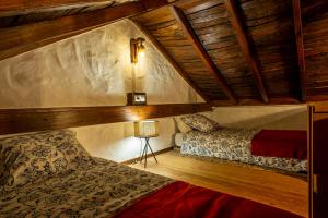 a bedroom with a bed and a lamp in a room at Casa Rural El Majano in Moya +37 photos