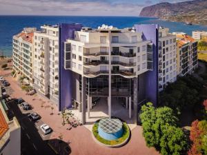 an aerial view of a building next to the ocean at Centromar Residence Ocean View By Atlantic Holiday in Funchal