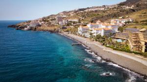 an aerial view of a beach with buildings and the ocean at Savana Apartment By Atlantic Holiday in Caniço