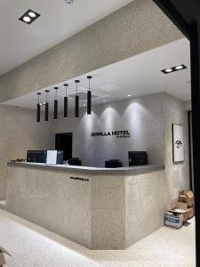 a lobby of a dental office with a reception counter at Gorilla Hotel in Wonju