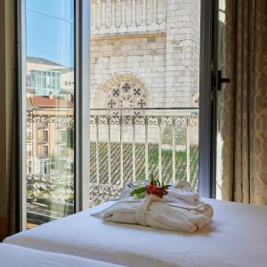 Postel nebo postele na pokoji v ubytování Nexus Valladolid Suites & Hotel