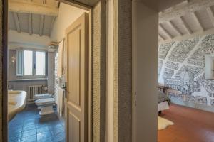 a bathroom with a toilet and a sink at Casolese di Vignamaggio in Greve in Chianti