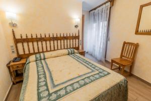 Cama o camas de una habitación en Hostal Santo Domingo de Silos
