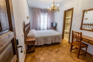 Cama o camas de una habitación en Hostal Santo Domingo de Silos