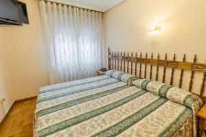 Cama o camas de una habitación en Hostal Santo Domingo de Silos