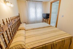 Cama o camas de una habitación en Hostal Santo Domingo de Silos
