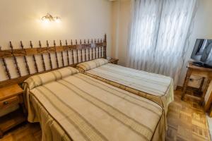 Cama o camas de una habitación en Hostal Santo Domingo de Silos