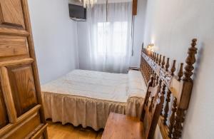 Cama o camas de una habitación en Hostal Santo Domingo de Silos