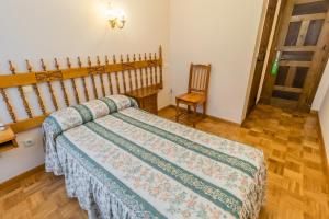 Cama o camas de una habitación en Hostal Santo Domingo de Silos