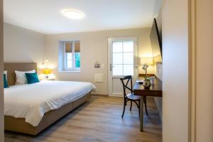 Cama o camas de una habitación en Auberge des Grands Bois
