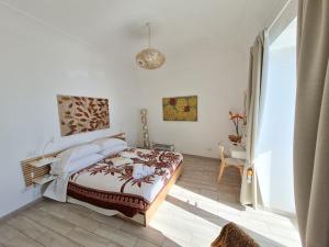 a bedroom with a bed and a pendant light at Suite Casalbivio in Positano