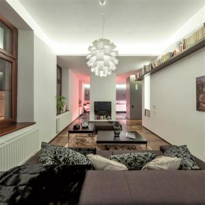 Televízia a/alebo spoločenská miestnosť v ubytovaní Apartament ST1