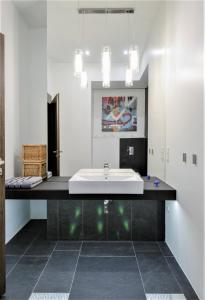 a bathroom with a sink and a mirror at Apartament ST1 in Cieszyn