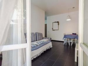 a living room with a couch and a table at Sciacchetrà Ground Floor Apartment with AC in Monterosso al Mare