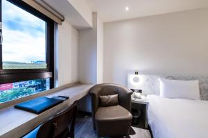 Hub Hotel - Songshan Airport Branchにあるベッド