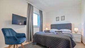 Postel nebo postele na pokoji v ubytování Modern Adora Apartment