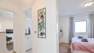 Postel nebo postele na pokoji v ubytování Modern Adora Apartment