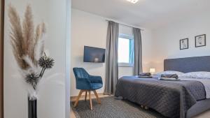Postel nebo postele na pokoji v ubytování Modern Adora Apartment