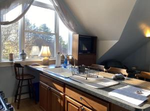 a kitchen counter with a sink and a window at Artful Lodging & Retreats in Montpelier +77 photos
