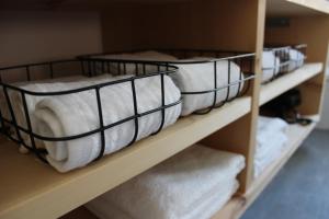 two bunk beds in a room with towels at paclera79 in Santa Maria Val Müstair