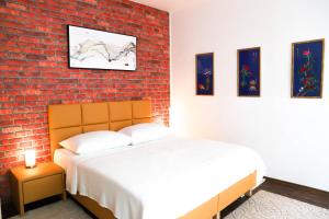 Posteľ alebo postele v izbe v ubytovaní «Go West» guest rooms