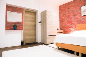 Posteľ alebo postele v izbe v ubytovaní «Go West» guest rooms