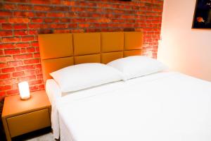 Posteľ alebo postele v izbe v ubytovaní «Go West» guest rooms