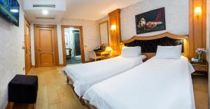 Postel nebo postele na pokoji v ubytování Aprilis Hotel - Special Category