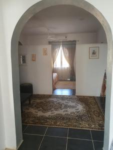an archway leading into a room with a bedroom at Dar Chick Yahia Ile De Djerba in Mezrane